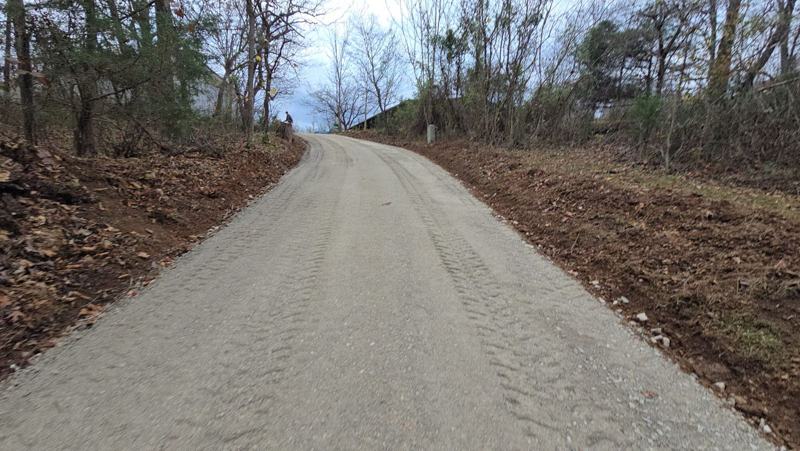 The same steep driveway after recovery, clean and graded